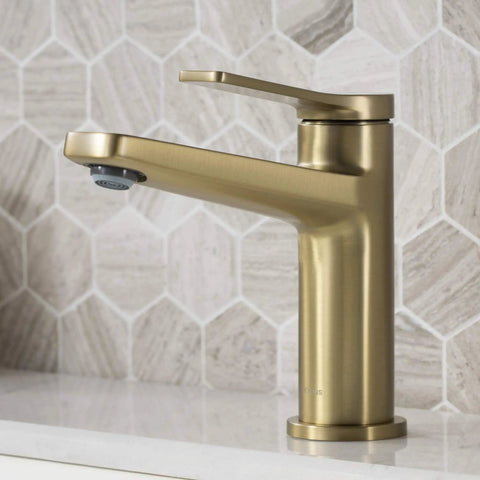 Indy Single Handle Basin Bathroom Faucet With Pop Up Drain And Overflow in Brushed Gold Solid Brass on white counter