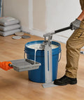 Heavy Duty Manual Loading Paste Pump With 15 Inch Handle and Stable Aluminum L Base for Thick Liquids in use with a blue bucket.