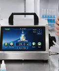 Savage High-Flow Automatic Bottle Filler Machine With Precision Multi-Mode Tech For Narrow Mouth Bottles And Tiny Neck Diameters Starting At 2mm on display with user controlling settings.