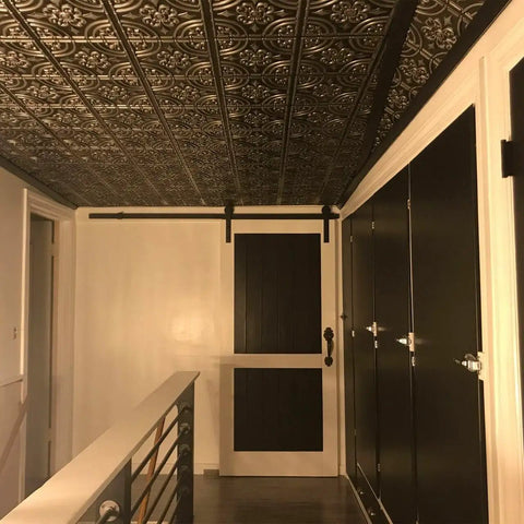 Stylish interior with Copper Faux Tin PVC Ceiling Tiles 2x2 Glue Up Easy Install Paintable Tin Look Ceiling Tiles For Quick DIY Makeover Covers 40 Sq Ft No Mess Lightweight And Durable, creating an elegant tin ceiling effect.