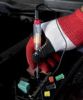 Person using a diagnostic tool on a car's electrical fuse box showcasing 48 Piece Tall And Low Profile Automotive Blade Fuse Assortment Kit With Puller Includes 20A 30A 40A 50A 60A 80A For Cars Trucks SUVs Boats UTVs ATVs And More Go To Fuse Kit