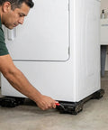 Man adjusting Heavy Duty 2 Pack Furniture Dolly With Sturdy Carbon Steel Build And Thick Rubber Pads For Washing Machine.