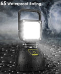 Rechargeable Foldable LED Work Light 32W with 8000mAh Battery illuminated in rain, showcasing IP65 waterproof rating