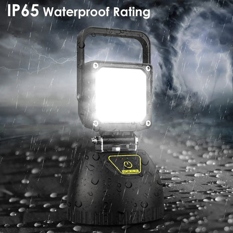 Rechargeable Foldable LED Work Light 32W with 8000mAh Battery illuminated in rain, showcasing IP65 waterproof rating