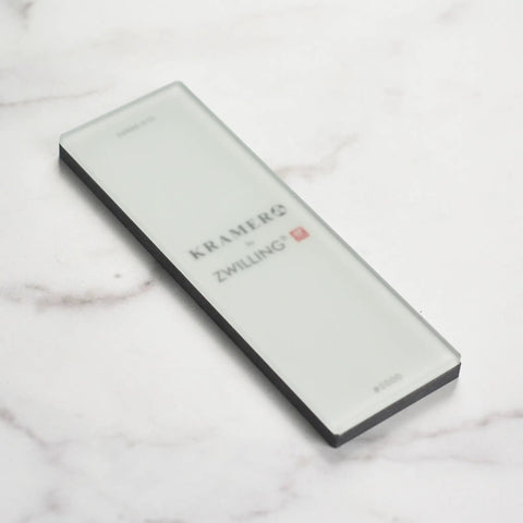 Zwilling 3000 Grit Glass Water Sharpening Stone For Ultra Fast Grinding And Ultra Low Wear on marble surface