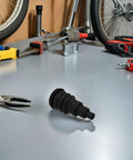 Rugged Rubber Grommet Kit For Automotive Wiring Harnesses And Wire Bundles Fits Three Eighths To One Inch Wires Durable Black Seals For DIY Install And Vehicle Cabling That Works Like A Charm, black rubber grommet on workbench