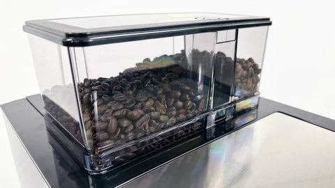 Smooth Operator Automatic Espresso Machine With No Sweat Touchscreen Controls And Eight Custom Drink Settings coffee bean hopper filled with dark beans.