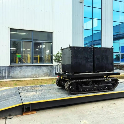 Heavy Duty Self Propelled Machinery Moving Dolly with Remote Control transporting large industrial box on a ramp.