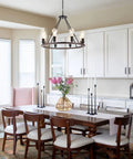 Black Wagon Wheel Light With Eight Lights Rustic Farmhouse Style Ceiling Pendant over dining table