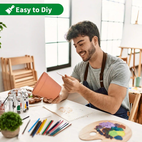 Man painting a Six Pack 6 Inch Terracotta Pots With Saucers For Indoor Outdoor Plants Drainage Hole Mesh Liners Included Great For Crafts And Wedding Favors Great For Gifting And Decor.