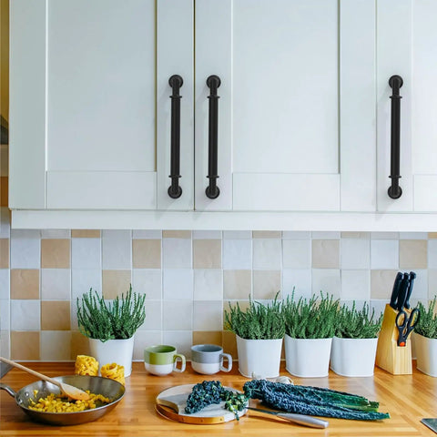 Six Pack 5 Inch Matte Black Cabinet Handles For Kitchen Cabinets with Modern Satin Black Finish displayed on white cupboard doors.