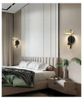 Modern Nordic Iron Wall Sconce With Glare Free Led Glow Perfect For Cozy Bedroom Reading And Hallways gives warm lighting in stylish bedroom.