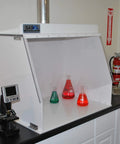 Heavy-Duty 40-Inch Wide Ducted Fume Hood With 6-Inch Exhaust Collar And LED Lighting in lab setting with colored flasks