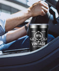 Born In 1976 Vintage 20 Oz Insulated Tumbler placed in car cup holder, showcasing its retro design and 304 grade steel material.