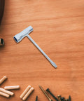 Three Piece Carbon Steel Spark Plug Wrench With Slick Ergonomic Handles For Mechanics And Diy Guys Looking For A Badass Double Ended Socket Kit That Handles Grease Work Without Any Sweat on wooden background.