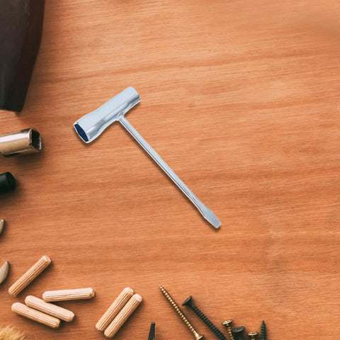 Three Piece Carbon Steel Spark Plug Wrench With Slick Ergonomic Handles For Mechanics And Diy Guys Looking For A Badass Double Ended Socket Kit That Handles Grease Work Without Any Sweat on wooden background.