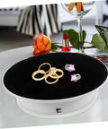 Premium Rotating Jewelry Display Stand With Smooth Electric Turntable Spin For Selling Accessories And Cosmetics, displaying rings.