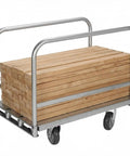 Heavy Duty Steel Platform Truck With Four Swivel Casters And Triple Handles Holding Up To 2500 Lbs, loaded with wooden planks.