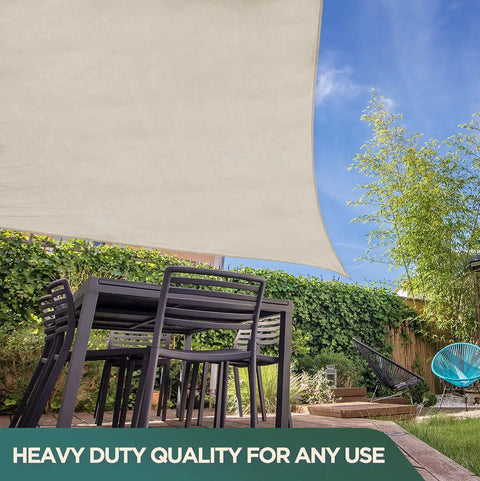 Rugged Cotton Duck Drop Cloth for Painting and Protection, heavy-duty canvas tarp used as sunshade over outdoor furniture in garden.