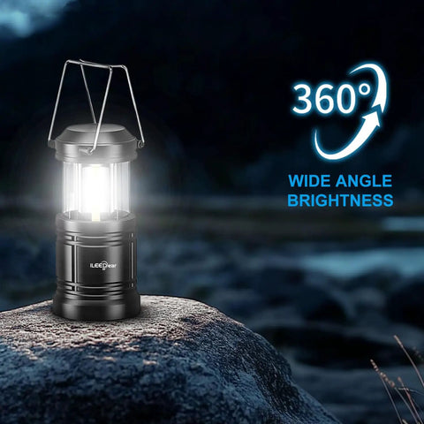 Portable LED Camping Lantern 2-Pack With Battery Operated Lights showing 360-degree illumination on a rock at night.