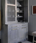 Top Tier Light Oak Reactive Water Based Wood Stain Zero VOC Heavy Duty 55 Gallon Drum near a Nordic-style cabinet with dishes.