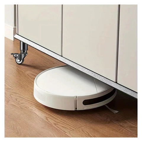 Kick Heavy Moves To The Curb 4 Pack Swivel Caster Wheels under furniture with white robotic vacuum on hardwood floor.
