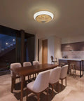 15 Inch Enclosed Bladeless Ceiling Fan with RGB Dimmable LED Light in modern dining room setting.