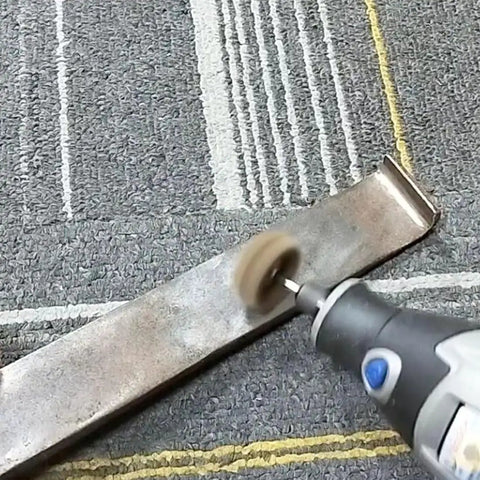 Rotary tool using 48 Piece Rotary Tool Buffing Wheel Set With Three Thirty Second Inch Mandrels And 2.35 Mm Shanks on metal