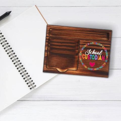 School Custodian Desk Organizer With Pen Trough And Retro Note Pad Holder Solid Gift for janitorial staff on white background.