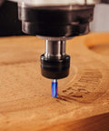 4-flute 90-degree V-groove carbide router bit with blue coating, 1/4 inch shank, cutting wood