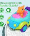Dinosaur themed toddler remote control car with lights featuring detachable orange dinosaur figure in a blue and green toy vehicle.
