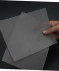 Hand holding stainless steel mesh from 4 Piece Quick Bumper Repair Mesh Kit, Stainless Steel Car Bumper Protector Mesh For Your Ride Auto Body Maintenance