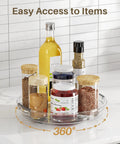 Smooth As Butter 4 Pack Lazy Susan Turntables with oils, spices, and jars on a clear, rotating tray in a kitchen setting.