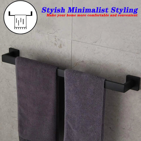 24 Inch Contemporary Stainless Steel Towel Bar Wall Mount With Slick Matte Black Finish holding towels in modern bathroom.