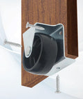 Close-up of a 2 Inch Low Profile Caster Wheels For Trundle Bed, Cabinet Roll Out Bed, And Drawer With Screws 4 Pack, Ideal For Tight Spaces