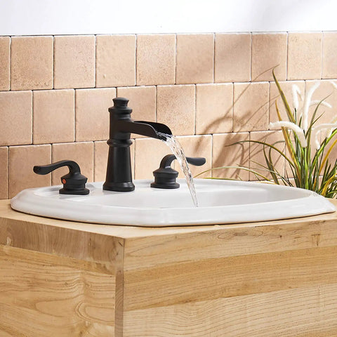 Widespread Matte Black Bathroom Faucet With Pop Up Drain For 3 Hole Install Two Handle Waterfall Lavatory Tap Includes Supply Hose For 8 To 16 Inch Vanities Modern Basin Mixer installed on a wooden vanity with water flowing from spout.