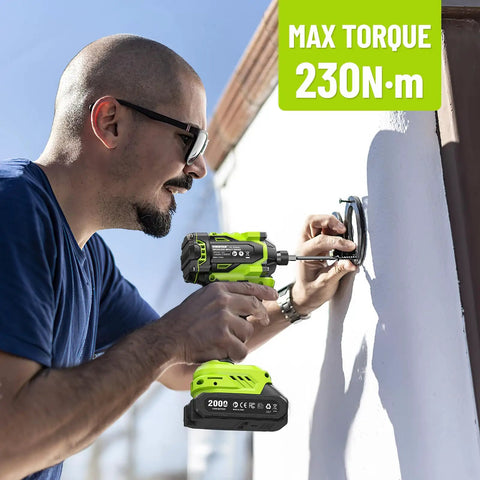 Man using 21V Cordless Impact Driver Kit With Brushless Motor One Quarter Inch Hex 230 Nm Torque 3300 RPM Includes Twenty Screwdriver Bits And Two Amp Hour Battery Variable Speed For DIY Automotive Work And Heavy Duty Fastening on wall