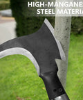 Close-up of high manganese steel double scythe with wooden handle, thick 2.8mm blade, against tree for outdoor weeding and mowing.