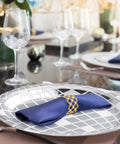 Totally Perfect 100 Pack 9 Inch Silver Disco Plates For 70s Party Decor showing elegant table setup with glasses