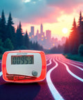Red Portable Mini Digital LCD Pedometer That Tracks Steps Distance Calories Burned Exercise Time And Daily Target With Accurate Sensor Tech For Walking Running And Fitness On The Go on a track