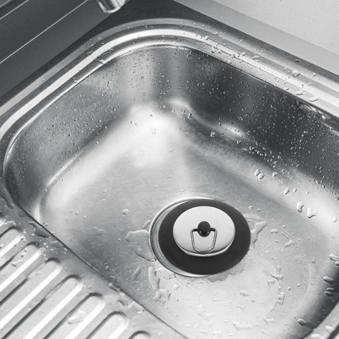 Rubber Bathtub Drain Plug with Stainless Steel Easy Pull-Out Stopper in a wet stainless steel sink.