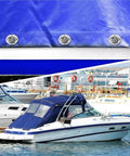 Twist-lock fasteners on blue boat canvas; three stainless steel units close-up