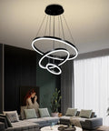 Slick Black Circular LED Pendant Light With Adjustable Height hanging above modern living room, 4000K white LED.