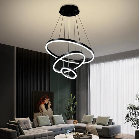 Slick Black Circular LED Pendant Light With Adjustable Height hanging above modern living room, 4000K white LED.