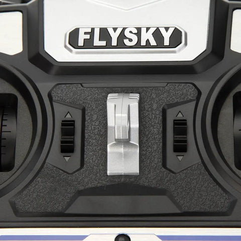 Close-up of AFHDS 2A 2.4GHz 4CH RC Transmitter for Helicopters and Gliders with FS-A6 Receiver controls and buttons.