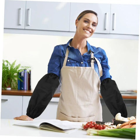 Oilproof Long Arm Sleeves For Men And Women With Heavy Duty Gunk Shielding shown on a woman cooking in a kitchen.
