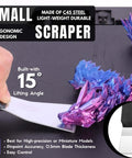 Person using small C45 steel scraper for model removal from 3D printer; Pro Grade All In One Go To 3D Printer Scraper Kit With Four Blade Types And Ten Spare Blades For Quick Model Removal From Large Medium And Small Prints Built For Safe Bed Access And Everyday 3D Printing.