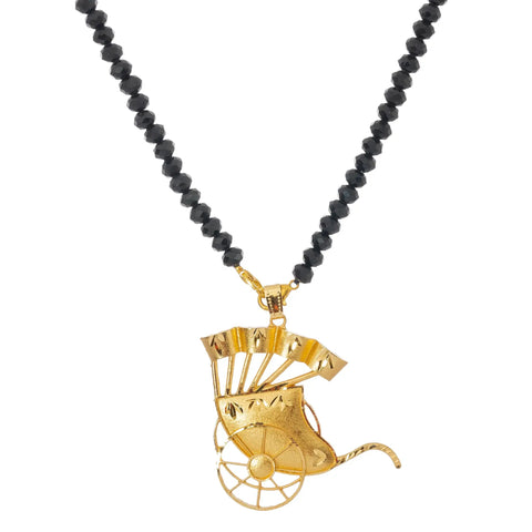 Handcrafted Gold Plated Indian Rickshaw Pendant Necklace Set With Matte Black Crystal Luxe Bead Chain detail view on white background.