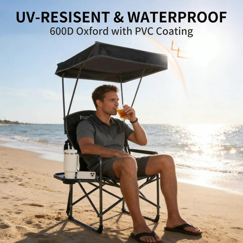 Man sitting on Heavy Duty Folding Camp Chair With Adjustable Canopy And Side Table, Oversized Directors Chair on the beach