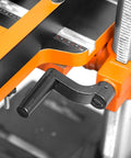 Close-up of a drill press with black and orange crank, part of the Drill Press Table With Adjustable Fence And Stop Block For Expanded Work Surface, 24 By 12 Inch Platform Fits All Drill Press Series, Clear Crank Access And Extra Workspace For Pro Level Projects.